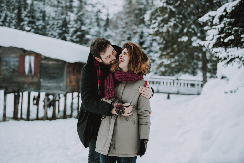 Couple at Lago di Braies in winter - Dolomites